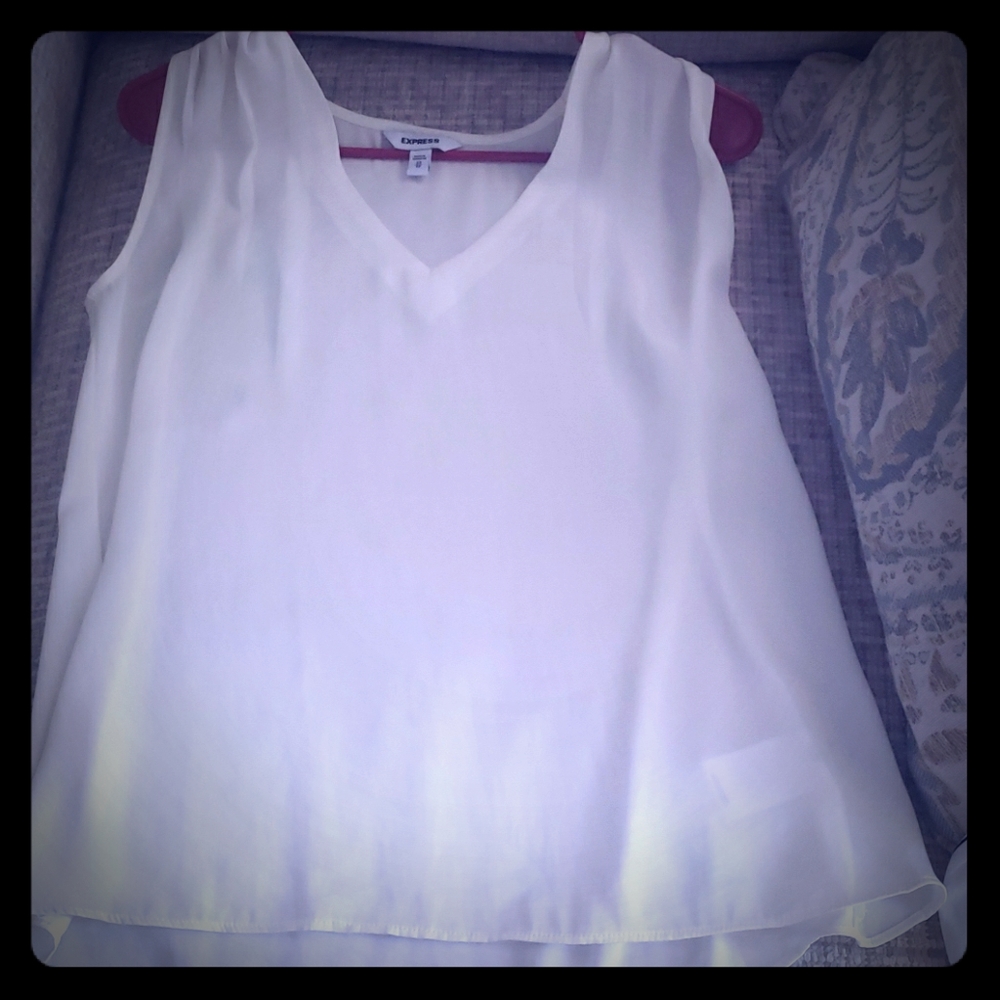 Ivory colored sleeveless blouse
